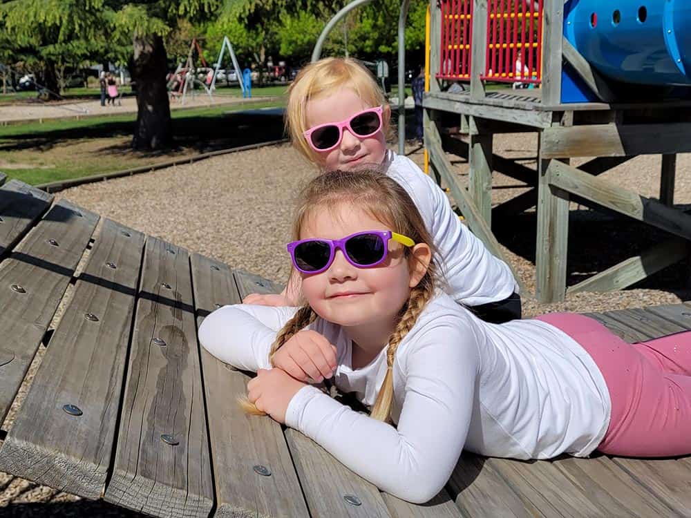 Eagle Eyes Kids Sunglasses - Hero - Girls Sunglasses - Playing on the playground at a park